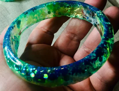 Ocean’s Muse” – Handcrafted Blue-Green Fantasy Fish Resin Bangle
