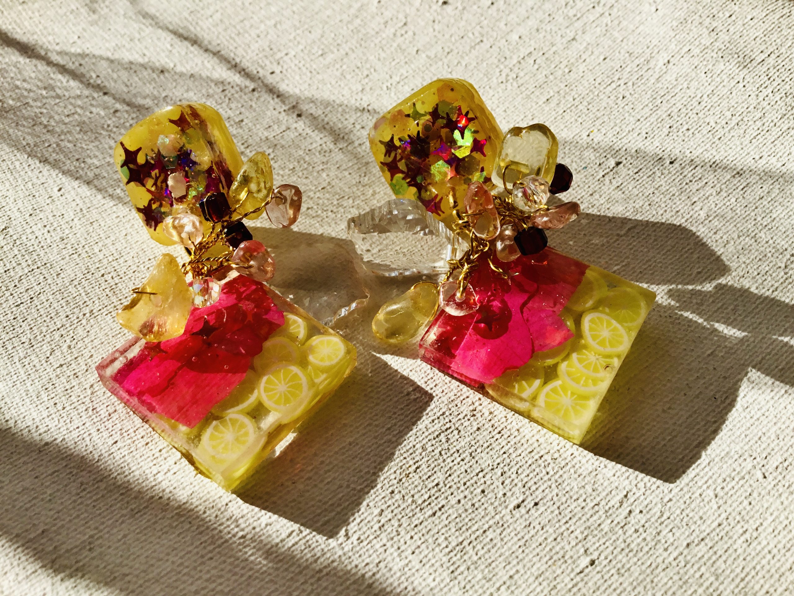 lemon earrings, citrus earrings, flower resin jewelry, real flower earrings, botanical jewelry, summer earrings, glow earrings, glow in dark, handmade earrings, resin earrings, statement earrings, fruit jewelry, lemon jewelry, citrus jewelry, citrine beads, ruby beads, glitter earrings, boho earrings, unique gift, gift for her, summer jewelry, nature jewelry, floral earrings, artisan jewelry, lightweight earrings, festival jewelry, beach earrings, romantic gift, dainty statement, handmade resin